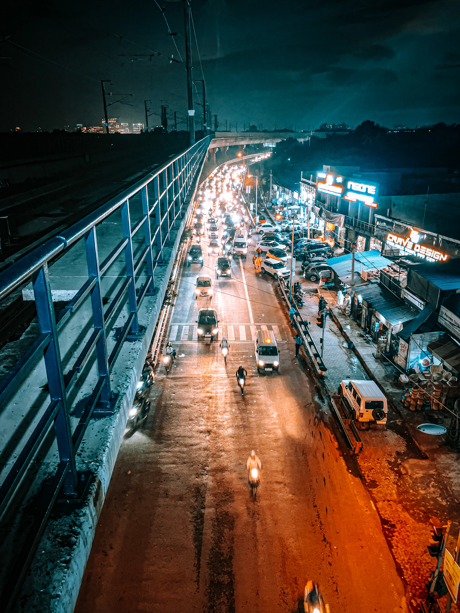 Traffic on a New Delhi street after dark